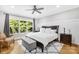 The spacious main bedroom boasts hardwood floors, natural light, and stylish furnishings at 174 Logan Crossing Dr, Davidson, NC 28036