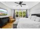 This main bedroom features hardwood floors, a large window, and a relaxing atmosphere at 174 Logan Crossing Dr, Davidson, NC 28036