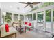 Cozy screened-in porch with comfortable seating and a view of the backyard pool at 174 Logan Crossing Dr, Davidson, NC 28036