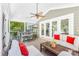 Relaxing screened porch with ceiling fan, outdoor seating, and television perfect for entertaining at 174 Logan Crossing Dr, Davidson, NC 28036