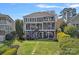Waterfront home featuring an expansive backyard and spacious deck at 17701 Springwinds Dr, Cornelius, NC 28031