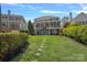Beautiful backyard of waterfront home with tiered deck and patio at 17701 Springwinds Dr, Cornelius, NC 28031