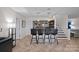 Entertaining bar area complete with barstools and shelving, perfect for entertaining guests at 17701 Springwinds Dr, Cornelius, NC 28031