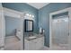 Well-lit bathroom featuring granite countertops, fresh vanity, and an elegant shower at 17701 Springwinds Dr, Cornelius, NC 28031