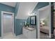 A well-lit bathroom has granite countertops, fresh vanity, and a view of the bedroom at 17701 Springwinds Dr, Cornelius, NC 28031
