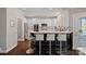 Modern kitchen with stainless appliances, granite countertops, and breakfast bar seating at 17701 Springwinds Dr, Cornelius, NC 28031