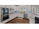 Updated kitchen with stainless steel appliances, granite countertops and a tile backsplash at 17701 Springwinds Dr, Cornelius, NC 28031