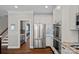 Bright and spacious kitchen features stainless steel appliances and white cabinetry at 17701 Springwinds Dr, Cornelius, NC 28031
