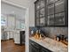 Modern kitchen area with dark cabinets and stainless steel appliances at 17701 Springwinds Dr, Cornelius, NC 28031