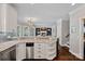 Kitchen with granite counters and stainless appliances opens to a living room with a fireplace at 17701 Springwinds Dr, Cornelius, NC 28031