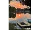 Scenic lake view at sunset, reflecting the warm glow of the setting sun at 17701 Springwinds Dr, Cornelius, NC 28031