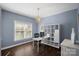 Office space with natural light, wood floors, built-in shelves, and a modern aesthetic at 17701 Springwinds Dr, Cornelius, NC 28031