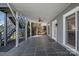 Covered patio with gray slate tile, providing ample outdoor living space at 17701 Springwinds Dr, Cornelius, NC 28031