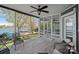 Screened-in porch with comfortable seating and scenic lake views at 17701 Springwinds Dr, Cornelius, NC 28031