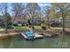 Picturesque waterfront property with a private dock, showcasing serene lake views and beautiful landscaping at 17701 Springwinds Dr, Cornelius, NC 28031