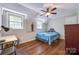 Bedroom with wood floors, desk, ceiling fan, and natural light from two windows at 1774 Hwy 55 E Hwy, Clover, SC 29710