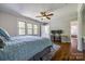 Bedroom with hardwood floors, windows, ceiling fan, and computer setup at 1774 Hwy 55 E Hwy, Clover, SC 29710