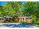 Charming brick home with lush green trees and well-manicured lawn, offering a serene and inviting curb appeal at 1774 Hwy 55 E Hwy, Clover, SC 29710