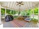 Cozy screened gazebo features comfortable seating and a ceiling fan, perfect for enjoying the outdoors at 1774 Hwy 55 E Hwy, Clover, SC 29710
