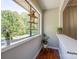 Hallway with hardwood floors, large window with garden shelf, and potted plants at 1774 Hwy 55 E Hwy, Clover, SC 29710