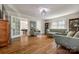 Cozy living room with hardwood floors, comfortable seating, and access to bonus room offering relaxation and entertainment at 1774 Hwy 55 E Hwy, Clover, SC 29710