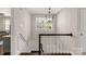 Elegant staircase with classic black and white railing and natural light at 1774 Hwy 55 E Hwy, Clover, SC 29710