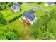 Aerial view of a home with a large backyard, deck, and manicured lawn in a quiet neighborhood at 2050 Sunswept Ln, York, SC 29745