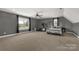 Large bedroom with a ceiling fan, carpeted floors, two windows and exercise equipment at 2050 Sunswept Ln, York, SC 29745