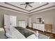 Bright bedroom with tray ceilings, hardwood floors, with white furniture and an open layout at 2050 Sunswept Ln, York, SC 29745