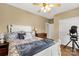 Charming bedroom with white furniture, hardwood floors, ceiling fan and a well-lit closet at 2050 Sunswept Ln, York, SC 29745