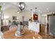 Open dining and living space featuring hardwood floors, contemporary lighting, and seamless flow at 2050 Sunswept Ln, York, SC 29745