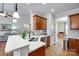 This spacious kitchen features stainless steel appliances, white countertops, wooden cabinets, and an undermounted sink at 2050 Sunswept Ln, York, SC 29745