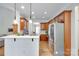 This open-concept kitchen features custom cabinets and stainless steel appliances at 2050 Sunswept Ln, York, SC 29745