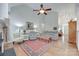 Open-concept living room with hardwood floors, a neutral sofa, and a fireplace, providing an inviting space for relaxation at 2050 Sunswept Ln, York, SC 29745