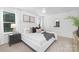 This bedroom has bright, natural light, neutral decor, and well-placed furniture at 2125 Tom Sadler Rd # 7159, Charlotte, NC 28214