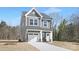 Charming two-story home with a gray exterior, white trim, and an attached garage at 2125 Tom Sadler Rd # 7159, Charlotte, NC 28214