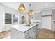Bright, open kitchen with a large center island, modern appliances, and stylish pendant lighting at 2125 Tom Sadler Rd # 7159, Charlotte, NC 28214