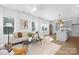 Bright and airy living room with a modern color palette and open access to the kitchen and dining areas at 2125 Tom Sadler Rd # 7159, Charlotte, NC 28214