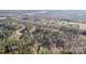 Aerial view of a neighborhood with tree coverage and houses, highlighting the community's serene setting at 227 Spicewood Cir, Troutman, NC 28166