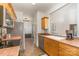 Functional kitchen with stainless steel appliances, tile countertops, and ample wood cabinet space at 227 Spicewood Cir, Troutman, NC 28166