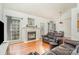 Inviting living room features a cozy fireplace, large window with natural light and hardwood flooring at 227 Spicewood Cir, Troutman, NC 28166