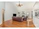 Bright living room features a fireplace, hardwood floors, and neutral paint, creating a warm atmosphere at 227 Spicewood Cir, Troutman, NC 28166