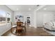 Bright dining area with hardwood floors and a round wooden table near the kitchen and living room at 2509 Lanecrest Dr, Charlotte, NC 28215