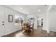 Bright dining area with hardwood floors and a round wooden table near a bright window at 2509 Lanecrest Dr, Charlotte, NC 28215