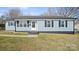 Charming single-story home with light blue siding, black shutters, and well-maintained front yard at 2509 Lanecrest Dr, Charlotte, NC 28215