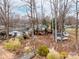 Aerial view of the home with lake access, mature trees, and a private setting, ideal for nature lovers at 265 Sailboat Dr, Salisbury, NC 28146