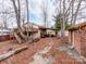 Exterior view of the home with a carport, deck, and mature trees, providing a private and serene setting at 265 Sailboat Dr, Salisbury, NC 28146