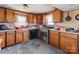 Traditional kitchen features wood cabinets, stainless steel appliances, and vintage accents, ready for renovation at 265 Sailboat Dr, Salisbury, NC 28146