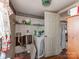 Laundry area with washer hookups and storage shelves, offering practical utility at 265 Sailboat Dr, Salisbury, NC 28146