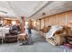 Spacious living room with paneled walls, a ceiling fan, and comfortable seating area, ready for updates at 265 Sailboat Dr, Salisbury, NC 28146
